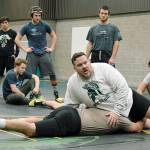 Auburn coach Matt Hoover demonstrates a move with his sparring partner, assistant coach Chad Potts. RACHEL CIAMPI, Auburn Reporter