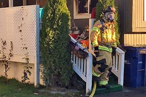 Two teens escape, one dog perishes in Auburn mobile home fire