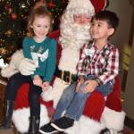 Cousins Lily Rhome, 5, and Austin Yaskus, 4, tell Santa what they want for Christmas. RACHEL CIAMPI, Auburn Reporter