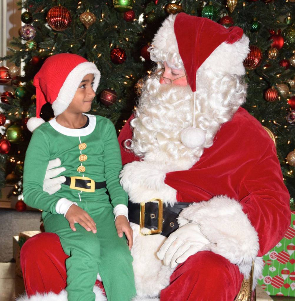 Aarav Pillay, 6, tells Santa what he wants for Christmas. RACHEL CIAMPI, Auburn Reporter