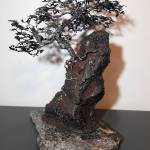 Wendy Rays welded steel and granite creation, a growing tree titled Rocky Solitude, is out of repurposed materials and part of the CVG Show in Bremerton this month. COURTESY PHOTO, Wendy Ray