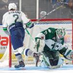 The Thunderbirds Austin Strand slides the puck past Silvertips goalie Carter Hart in what turned out to be the game-winning shot in Saturday nights shootout at the accesso ShoWare Center. COURTESY PHOTO, Brian Liesse, T-Birds