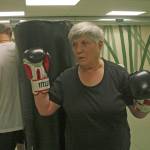 Sylvia Junt and Dave Covey circle the bag in a drill on motion and balance during a Rock Steady Boxing workout
at Longevita Pilates Yoga Studio in Auburn last week. The therapy session helps Parkinsons sufferers fight its symptoms.                                 MARK KLAAS, Auburn Reporter