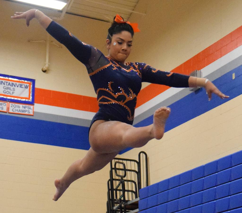 Auburn Mountainviews Ariana Martinez posts an 8.9 on the beam during the 4A West Central District finals Saturday, adding to the Lions state-qualifying team score. RACHEL CIAMPI, Auburn Reporter