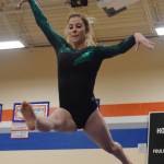 Auburn senior Ali Tate, the all-around district champion, performs on the balance beam, scoring an 8.975. RACHEL CIAMPI, Auburn Reporter