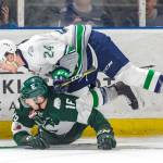 The Thunderbirds Jake Lee collides with the Silvertips Luke Ormsby along the boards during WHL play Friday night. COURTESY PHOTO, Brian Liesse, T-Birds