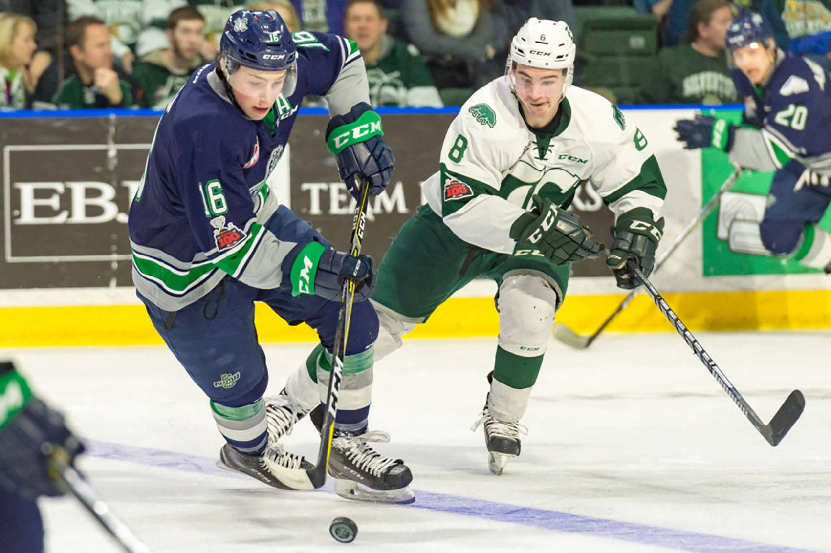 Thunderbirds center Noah Philp handles the puck with the Silvertips Patrick Bajkov defending during WHL play Saturday night in Everett. COURTESY PHOTO, Brian Liesse, T-Birds