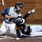 Kentlakes Dylan Mackie slides safely at home, beating the tag from Auburn Riverside catcher Ryan Kvamme during an NPSL cross-divisional baseball game Monday night. Kentlake prevailed, 3-2. RACHEL CIAMPI, Auburn Reporter