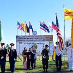 Alyssa Pham, Roselie Nguyen and veteran Ton That Hong address the crowd with honor guards holding flags at the groundbreaking for the Vietnamese-American War Memorial at Les Gove Park on Sunday. RACHEL CIAMPI, Auburn Reporter
