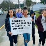Japnoor Sandhu, top left, and Asia Bol, top right, freshman at Auburn Mountainview High School, joined Wednesdays nationwide student walkout and march they said, because they want schools to be what they should be: places to learn, not places to be shot. ROBERT WHALE, Auburn Reporter