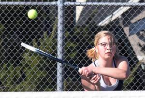 Ravens split two dual matches to open season