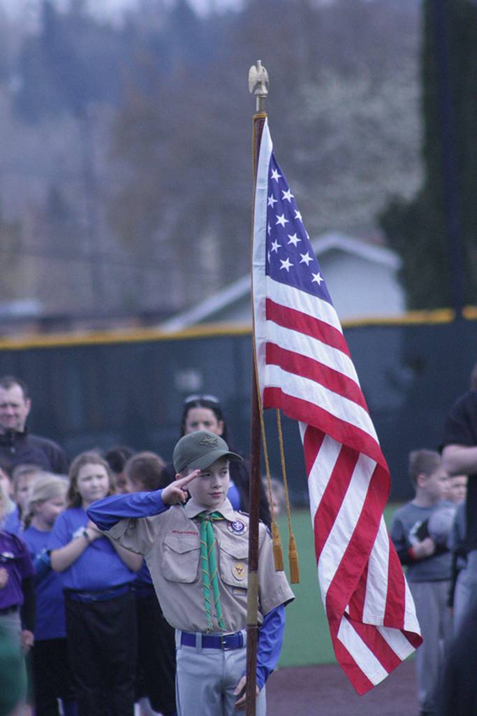 Troop 401 leads the crowd in honoring America. MARK KLAAS, Reporter