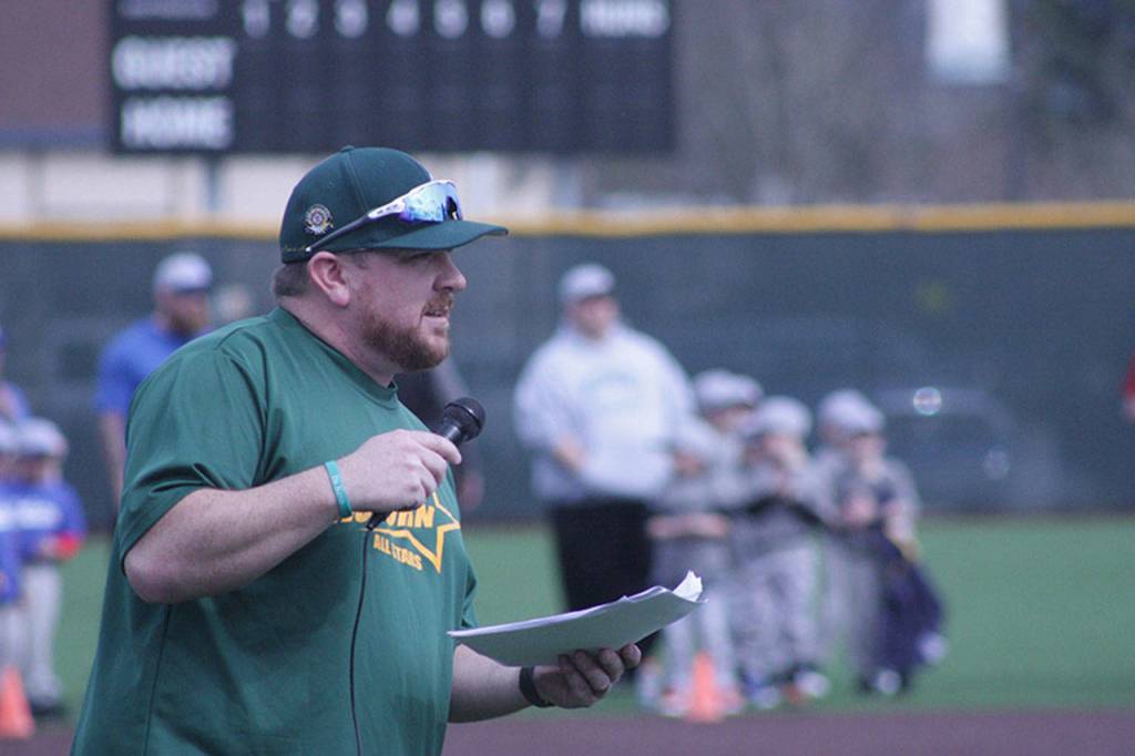 Auburn Little League President Zeb Olson makes some opening-day announcements. MARK KLAAS, Auburn Reporter