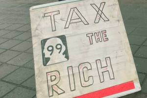 Rally in the rain against the rich