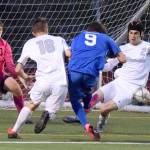 Auburn Riversides Reis McNeill, right, and Curtis Van Daele converge on Federal Ways Connor Wells as goalkeeper Riley Dunne anticipates the shot during last Fridays match. RACHEL CIAMPI, Auburn Reporter