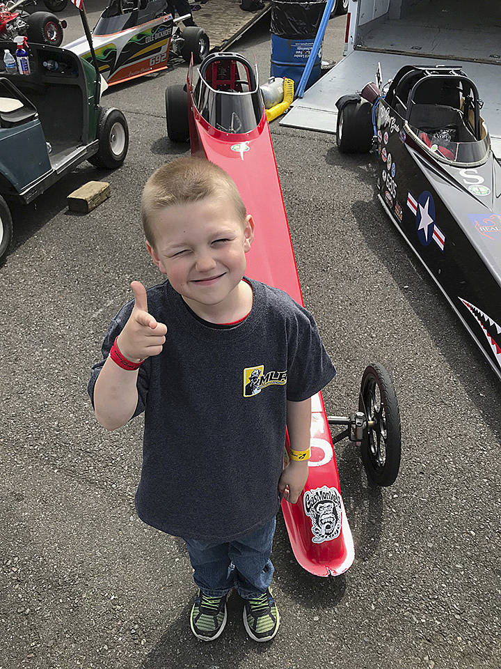 Oak Harbors Bailey Benda, 5, give the thumbs-up before qualifying at Pacific Raceways. He joins his brother, ORiley, in the Junior Dragster ranks this season and enjoys the sport. Its my favorite thing to do, he said. I wish the track went to infinity. The Benda family frequently makes the trip to the Kent track to compete. MARK KLAAS, Kent Reporter