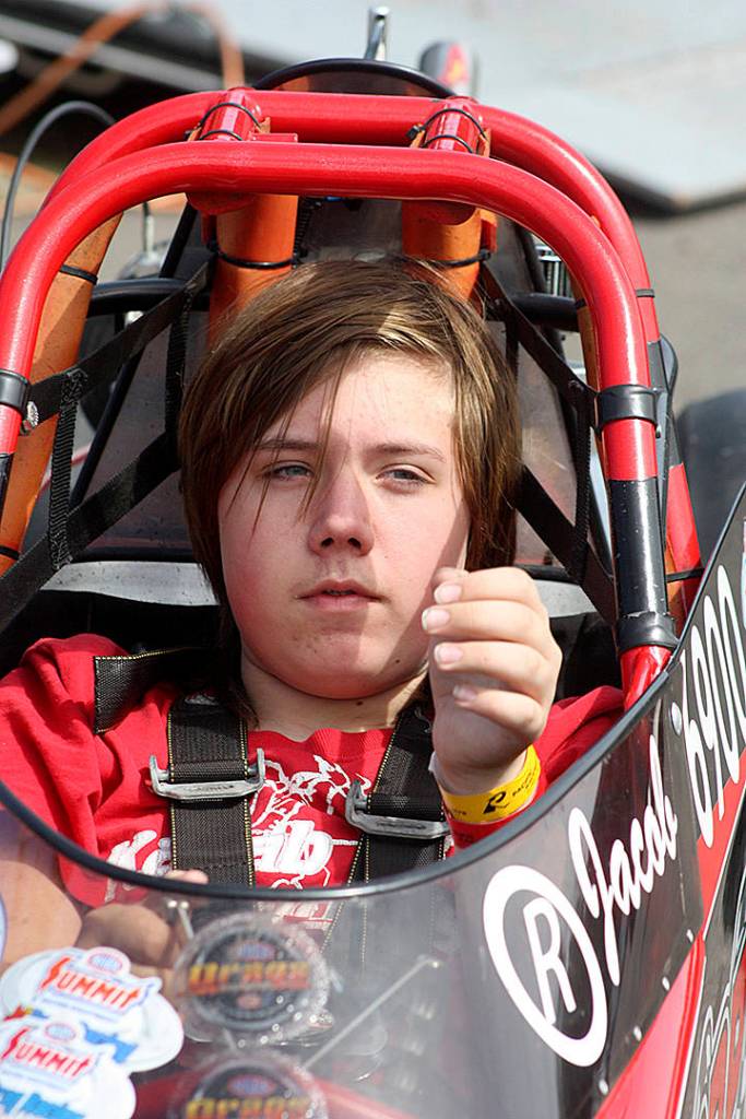 Auburns Jacob Laitila, 14, looks on, as his dad, James, prepares his Junior Dragster for a day of qualifying and eliminations at Pacific Raceways. MARK KLAAS, Kent Reporter