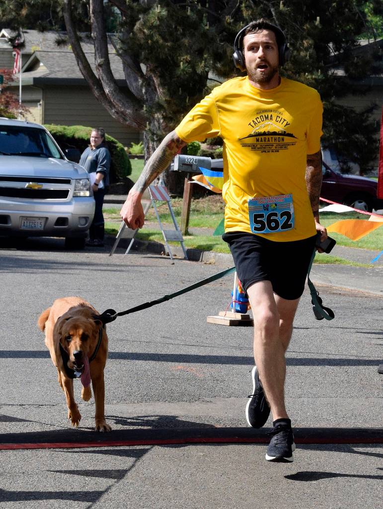 Cody Olney and his dog Esbe scooted to victory in the 5K Dog Trot. RACHEL CIAMPI, Auburn Reporter