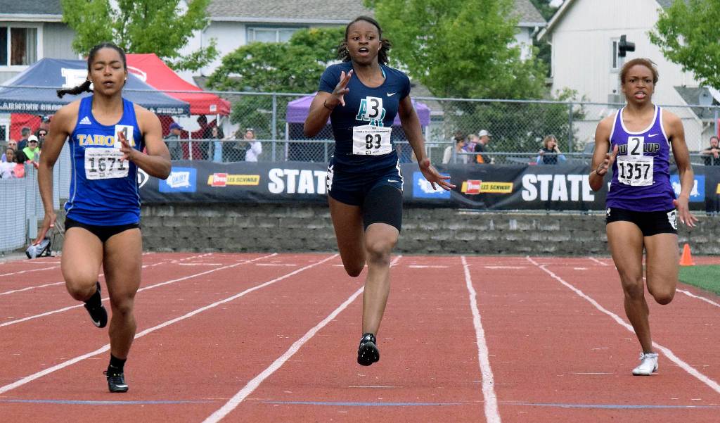 Auburn Riversides Aulane Mpouli, middle, darts the finish in the 200 meters at the 4A track and field championship last weekend. She finished third at 24.65 seconds. RACHEL CIAMPI, Auburn Reporter