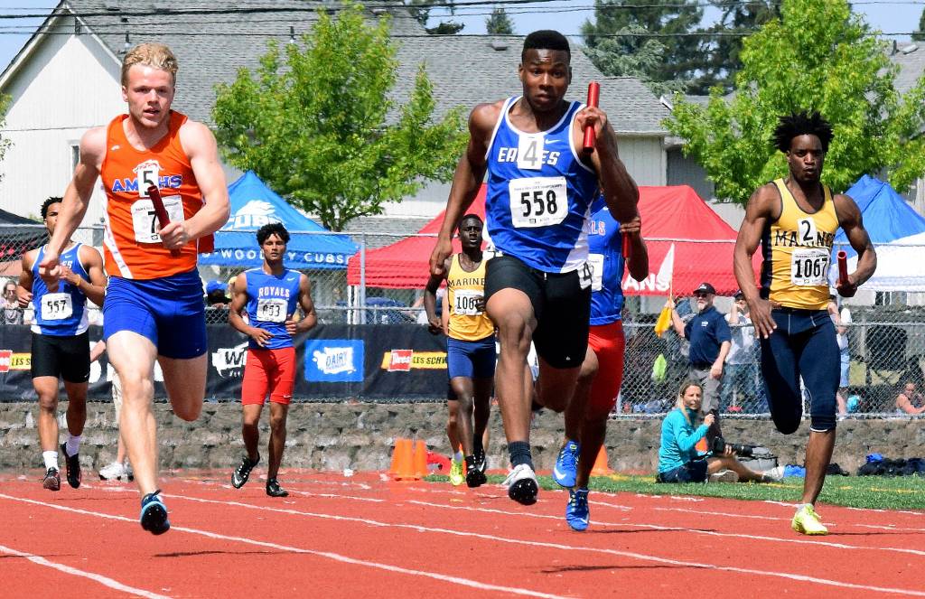 Auburn Mountainviews Talan Alfrey, left, anchors the 400 relay in a preliminary heat. Federal Ways Marcus Eubanks, middle, brought home the victory in the finals, and the Lions followed in third with a school-record 42.39. RACHEL CIAMPI, Auburn Reporter