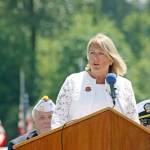 Monica McNeal, who lost her son in the war in Afghanistan, speaks to the crowd assembled for the ceremony at Tahoma National Cemetery on Monday. McNeal, the keynote speaker, is president of the Washington chapter of American Gold Star Mothers. MARK KLAAS, Kent Reporter