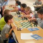 Boys and girls test their skills and strategies at a youth tournament recently staged in the Auburn High School Commons. ROBERT WHALE, Auburn Reporter