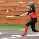 The Auburn Rainiers Angie Juarez connects for a hit during the championship game against the Auburn Diamond Divas. RACHEL CIAMPI, Auburn Reporter