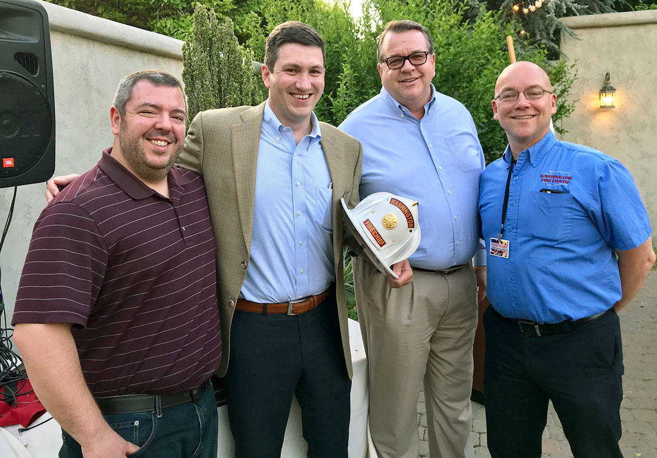 From left: Dylan Doty, Washington Fire Chiefs lobbyist; Rep. Drew Stokesbary, R-Auburn; Eric Robertson, Valley Regional Fire Authority administrator; and Keith Wright, president of Washington Fire Chiefs and Central Pierce Fire & Rescue battalion chief. COURTESY PHOTO