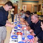 Alex Garcia and Tapiwa Ngungu serve chili to the judges. RACHEL CIAMPI, Auburn Reporter