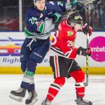 The Thunderbirds Donovan Neuls, left, collides with the Winterhawks Mason Mannek during WHL play last season. The I-5 rivals tangle again in Seattles home opener Sept. 22. COURTESY PHOTO, Brian Liesse, T-Birds