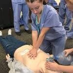 Alyssa Price, a junior-to-be at Kentlake High School, works on reviving a CPR manikin patient during Nurse Camp at Tacoma General Hospital last week. MARK KLAAS, Reporter