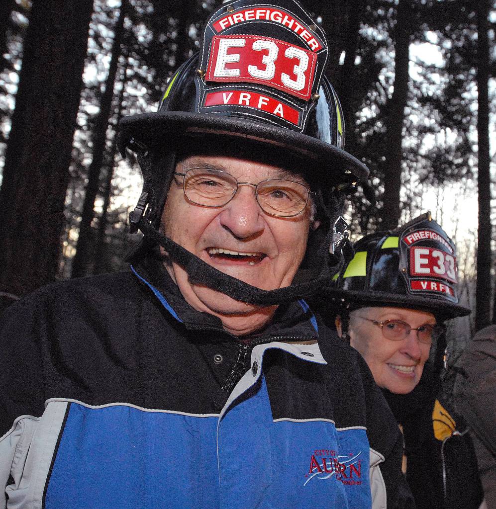 Auburn City Council member Gene Cerino dons a firefighter hat before the groundbreaking for the new Valley Regional Fire Authority Lakeland Fire Staton 33 in 2008. REPORTER FILE PHOTO