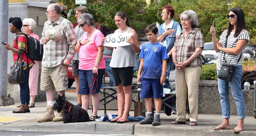 Jeff Monk (grandpa), Yvonne Monk (grandma), Maya Carl (12) holding the sign, Kuhio Carl (10), Dee Giles (great-grandma), Krissie Carl (mom), and their dog Katie watching the procession. RACHEL CIAMPI, Auburn Reporter