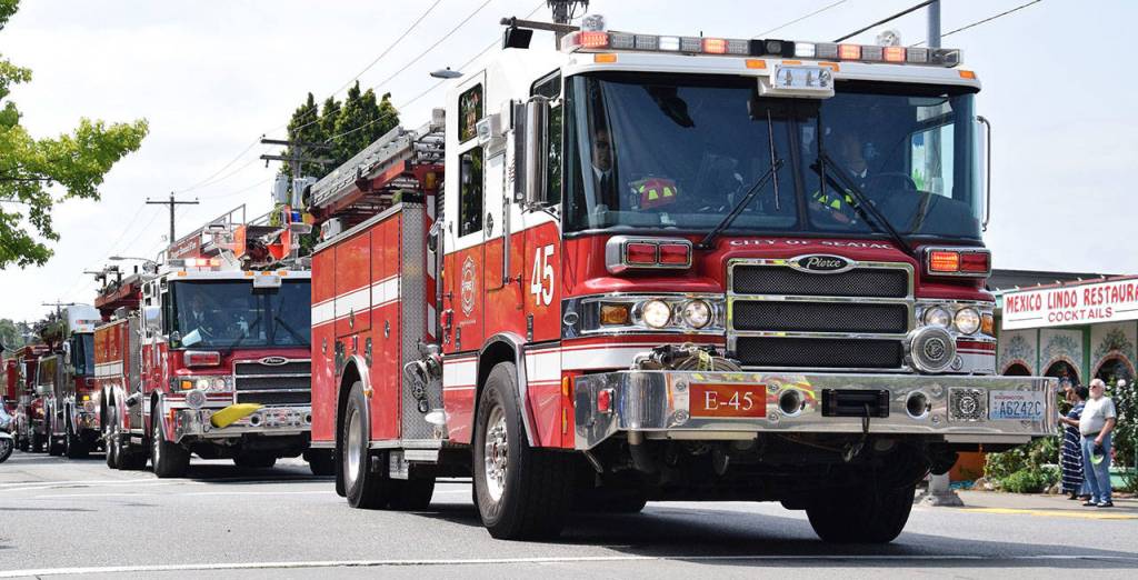 Fire departments join the procession. RACHEL CIAMPI, Auburn Reporter