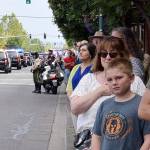 People line Fourth Avenue North as a procession for fallen Kent Police Officer Diego Moreno heads to the accesso ShoWare Center for a memorial service Tuesday. RACHEL CIAMPI, Auburn Reporter