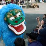 A Shiisa, a lion-like, mythical, spiritual guardian similar to a Chinese Foo Dog, stirs the crowd during the Bon Odori Festival at the White River Buddhist Temple last Saturday. MARK KLAAS, Auburn Reporter
