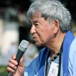 Joe Watanabe, an event organizer, delivers announcements during the Bon Odori program. MARK KLAAS, Auburn Reporter