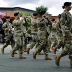 The Veteran Band marches in the parade. Right, Kolby Benson, 4, and his friend, Ashley Lewis, take in the classic makes at the car show.