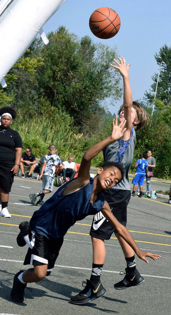 The Gray teams Carson Steele releases a shot over Navy Blue teams Trey Weatherspoon in a game between fifth-graders. RACHEL CIAMPI, Auburn Reporter