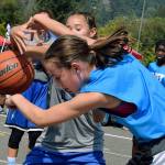The Just Do It light blue team tangles the LSN gray team for the ball during seventh-grade division play at the Slick Watts Classic 3-on-3 outdoor basketball tournament last Saturday. RACHEL CIAMPI, Auburn Reporter