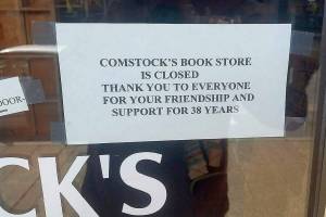Customers who hope to enter Comstocks Bookstore find this note. Comstocks, a mainstay on Main Street, is no longer. ROBERT WHALE, Auburn Reporter