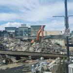 A demolition crew was busy last week tearing down and removing the debris of the historic Heritage Building in downtown Auburn. What will become of the property is a subject of fierce speculation. ROBERT WHALE, Auburn Reporter