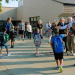 Pacific Mayor Leanne Guier and other representatives from the cities of Pacific and Algona greet students back to class at Alpac Elementary School on Sept. 5. COURTESY PHOTO