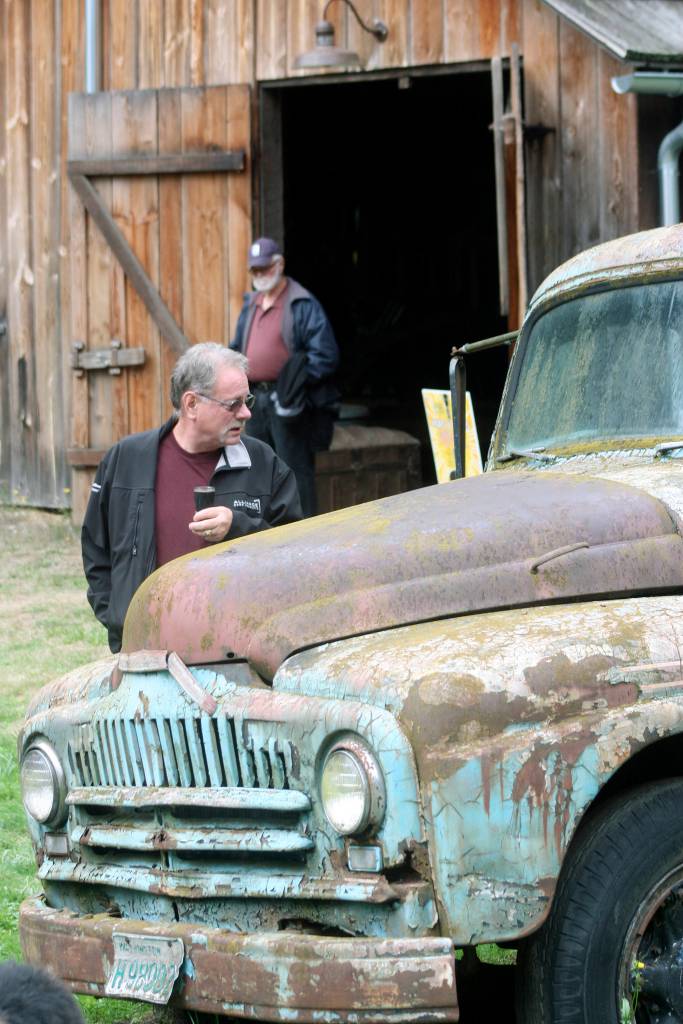 Visitors take in the historic barn, vintage truck and other features on the farm. MARK KLAAS, Auburn Reporter