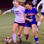Auburn Riversides Kayla Rydberg, left, and Auburn Mountainviews Elin Hires battle for the ball during NPSL girls soccer action Wednesday night. RACHEL CIAMPI, Auburn Riverside