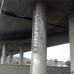 Graffiti, like this displayed under the State Route 18 overpass, lingers in parts of Auburn. FILE PHOTO