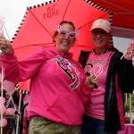 Auburn High staff Marci Killian, a 1985 graduate, left, and Michelle Lumas take in the tailgate party. RACHEL CIAMPI, Auburn Reporter