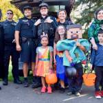 Mayor Nancy Backus, far left, and Auburn Police join trick-or-treaters for last years festival at Les Gove Park. RACHEL CIAMPI, Auburn Reporter