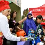 Auburn Police volunteers give out candy to trick-or-treaters at their sugar shack.