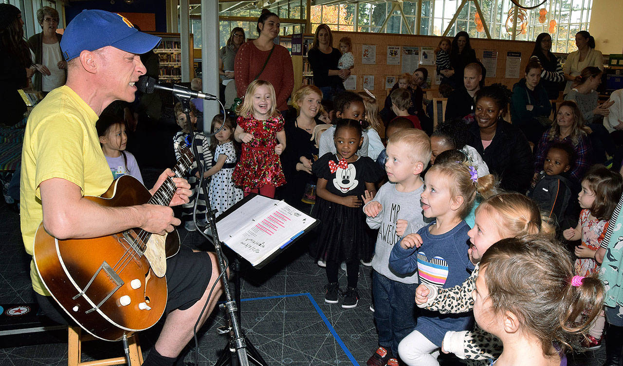Kids move to the music of Chris Ballew at the Auburn Library on Thursday. Ballew, a former lead singer and basitarist of the alternative rock group The Presidents of the United States of America, performs as a childrens artist under the pseudonym Caspar Babypants. RACHEL CIAMPI, Auburn Reporter